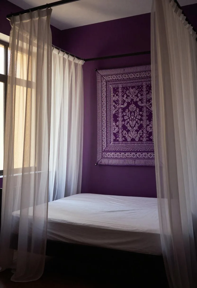 Sheer canopy bed against a deep plum accent wall with a batik fabric panel in a dramatic bohemian bedroom